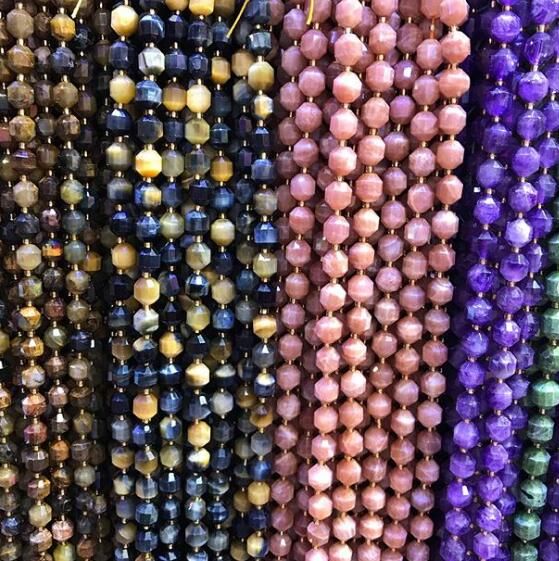 beads are lined up in rows on display