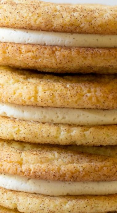 a stack of cookies with white frosting on top