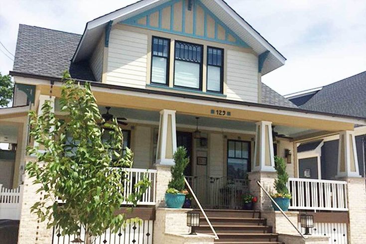 a house that has stairs leading up to the front door