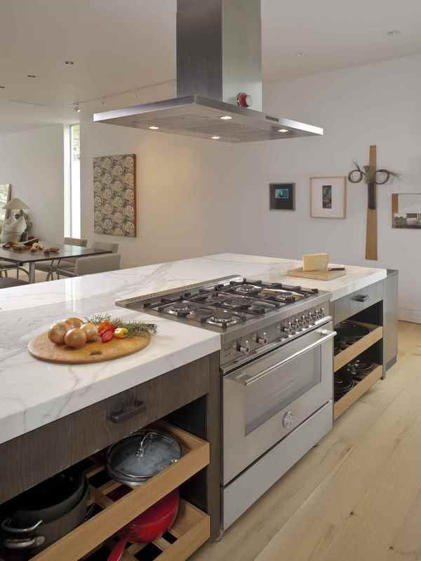 a kitchen with an oven, stove and counter top