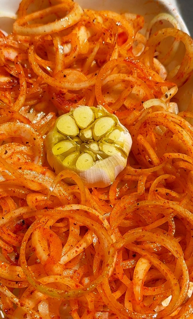 an onion and garlic dish is shown in a bowl