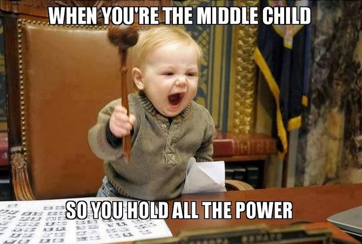 a little kid sitting at a table with a pen in his hand and the caption says, when you're the middle child so you hold all the power