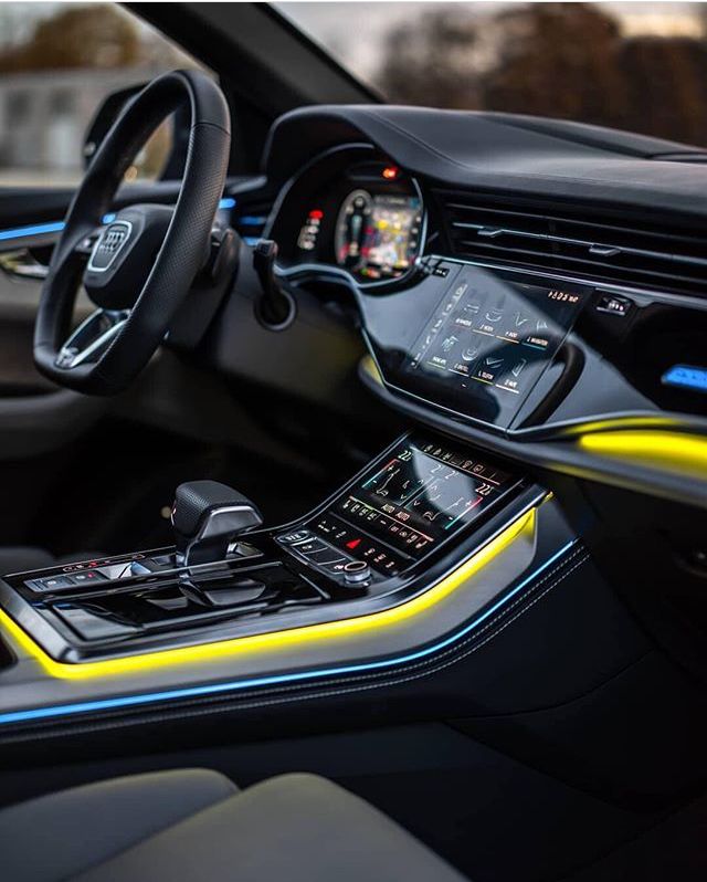 the interior of a modern car with yellow trim