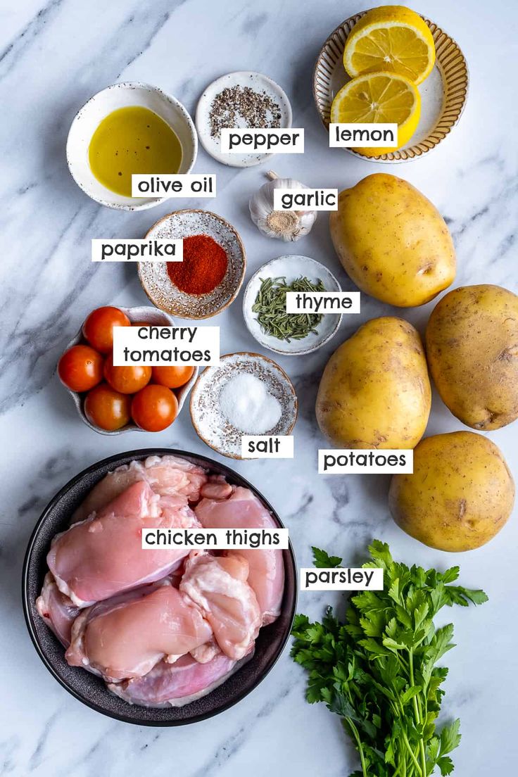 ingredients for chicken thighs laid out on a white marble counter top with text overlay