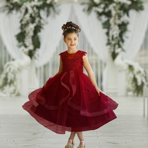 Dressing up your little girl should feel fun and exciting. We want you to experience that while shopping for your little one. This burgundy baby dress and girl’s dress is a unique and stunning design with high-quality embellishments. Using horsehair trim, we keep this red toddler dress stiff enough so its layers settle elegantly on top of each other. It’s a poofy dream for your little girl which is sure to melt every heart at the event. The tea-length tulle skirt is nothing short of a flowy extr Red Toddler Dress, Burgundy Flower Girl Dress, Horsehair Hem, Red Flower Girl Dresses, Sara Dress, Tea Length Tulle, Tea Length Skirt, Daphne Dress, Parents Wedding