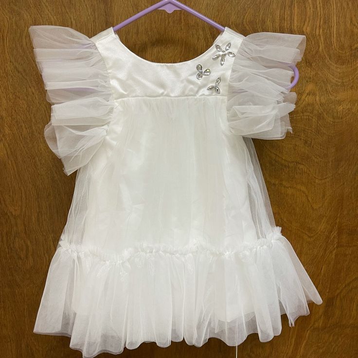 See All Pics. Condition: 10/10. Never Worn. Bout For My Daughter, But It “Wasn’t The Dress”. Make Me A Respectable Offer. Princess Style Dress With Flutter Sleeves For Dress-up, Princess Style Flutter Sleeve Dress, Princess Style Short Sleeve Baptism Dress, Ruffled First Communion Dress For Party, Holiday Ruffles Princess Dress For Baptism, White Short Sleeve Tutu Dress For Dress-up, Holiday Baptism Princess Dress With Ruffles, Holiday Princess Dress With Ruffles For Baptism, Princess Style Short Sleeve First Communion Dress