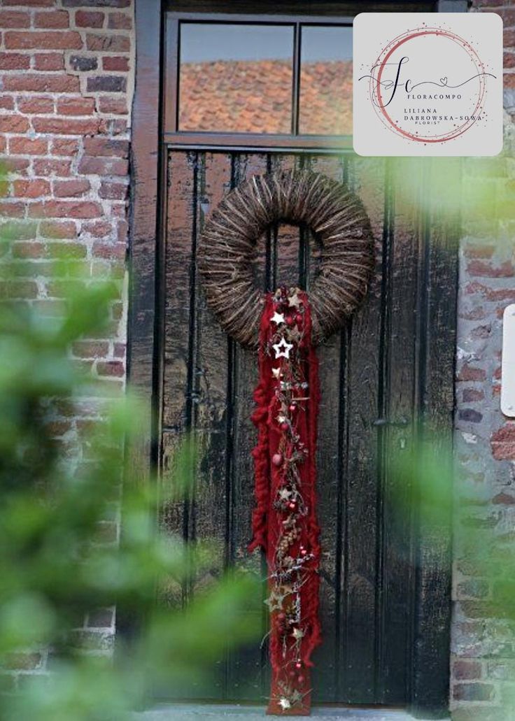 a wreath is hanging on the front door