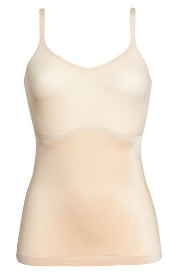 Create a smooth look under everyday outfits with this lightweight, breathable shaping cami that wraps around your body and targets your tummy and sides. The stretchy, single-layer fabric smoothes out any lumps or bumps, and the noncompression bust offers a squish-free fit. Scoop neck Adjustable straps 77% nylon, 23% elastane body; 55% nylon, 45% Lycra® elastane bust Machine wash, tumble dry Imported Summer Sculpting Seamless Shapewear, Summer Shaping Shapewear With Seamless Construction, Sleeveless Seamless Elastane Shapewear, Beige Sleeveless Smoothing Shapewear, Sleeveless Beige Smoothing Shapewear, Shapewear Camisole With Seamless Construction, Seamless Shapewear Tank Camisole, Seamless Shapewear Tank Top, Shaping Seamless Camisole