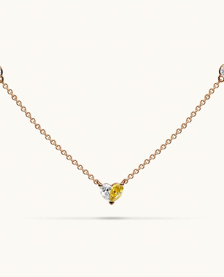 Introducing Paloma's iconic Heart necklace, a unique design that beautifully spotlights a fancy yellow diamond perfectly paired with a glistening white diamond, forming a flawless heart motif. The chain is adorned with diamonds by the yard, creating a radiant sparkle from every angle. Luxury Yellow Necklaces For Anniversary, Yellow Diamond Necklace For Anniversary, Yellow Diamond Fine Jewelry Necklace, Yellow Diamond-cut Necklace In Fine Jewelry Style, Fine Jewelry Yellow Diamond Necklace, Yellow Diamond Necklace In Fine Jewelry Style, Yellow Diamond Necklace With Brilliant Cut, Yellow Diamond Cut Necklace In Fine Jewelry Style, Yellow Rose Cut Diamond Jewelry