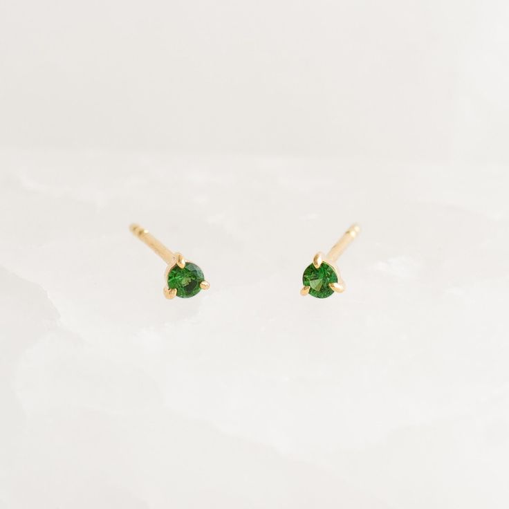 Inspired by the mystical allure of birthstones. These birthstone stud earrings feature dazzling tsavorite gemstones, expertly set in 14k yellow gold with three-prong settings.

A meaningful and stylish gift for anyone born in May.


Tsavorite (May birthstone) is the stone of compassion

Tsavorites have a width of 2.5mm 

Made with 14k yellow gold

Butterfly back closures Yellow Gold Tsavorite Gemstone Earrings, Tsavorite Gemstone Earrings For May Birthstone, Yellow Gold Tsavorite Earrings As Gift, Tsavorite Yellow Gold Earrings For Gift, Tsavorite Earrings Gift For May Birthstone, Tsavorite Earrings For May Birthstone Gift, Green 14k Gold Birthstone Earrings, 14k Gold Green Birthstone Earrings, Born In May