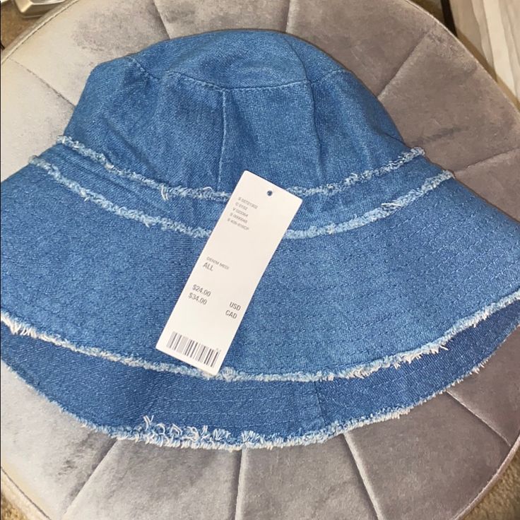 Never Worn. Dark Wash Color Summer Denim Bucket Hat With Curved Brim, Summer Medium Wash Brimmed Bucket Hat, Casual Denim Brimmed Sun Hat, Trendy Adjustable Denim Sun Hat, Casual Brimmed Denim Sun Hat, Denim Bucket Hat For Summer, Adjustable Medium Wash Bucket Hat For Summer, Summer Adjustable Medium Wash Bucket Hat, Trendy Denim Brimmed Sun Hat