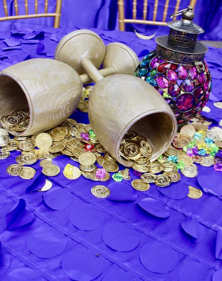 there are two vases and some coins on the table