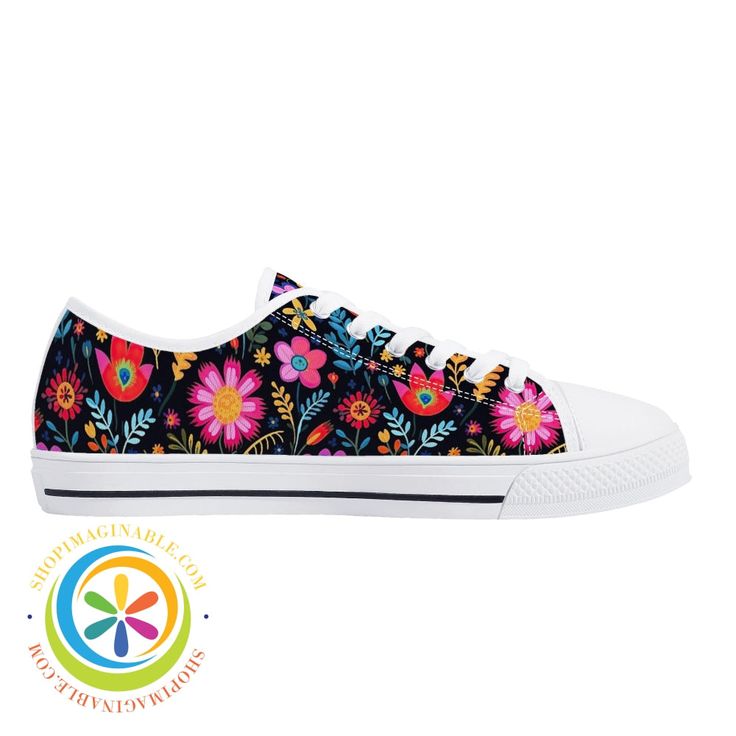 a pair of shoes with colorful flowers on the bottom and white soles, all in black