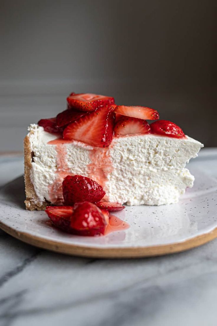 a piece of cheesecake with strawberries on top