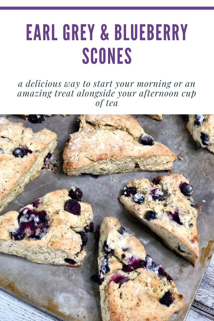 blueberry scones on a baking sheet with text overlay that reads, ear grey & blueberry scones