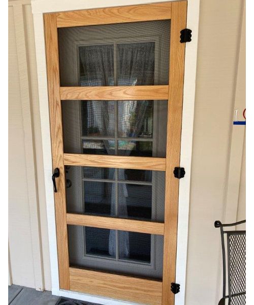 a wooden door with glass on the outside