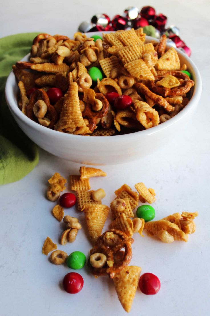 a white bowl filled with christmas cheerios on top of a table