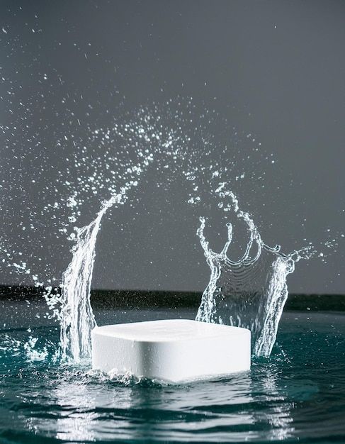 an object floating in the water on top of it's own surface with splashing water