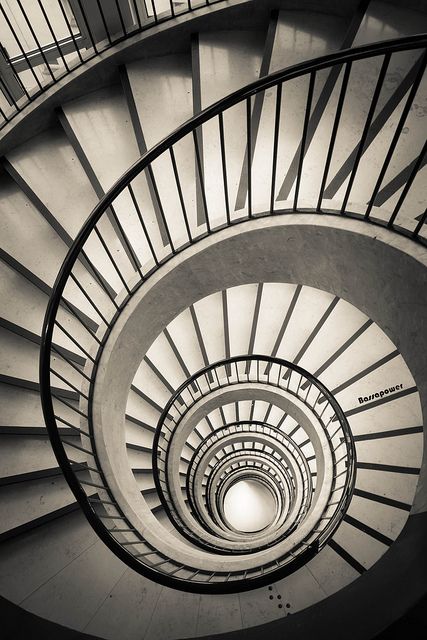 a spiral staircase is shown in black and white