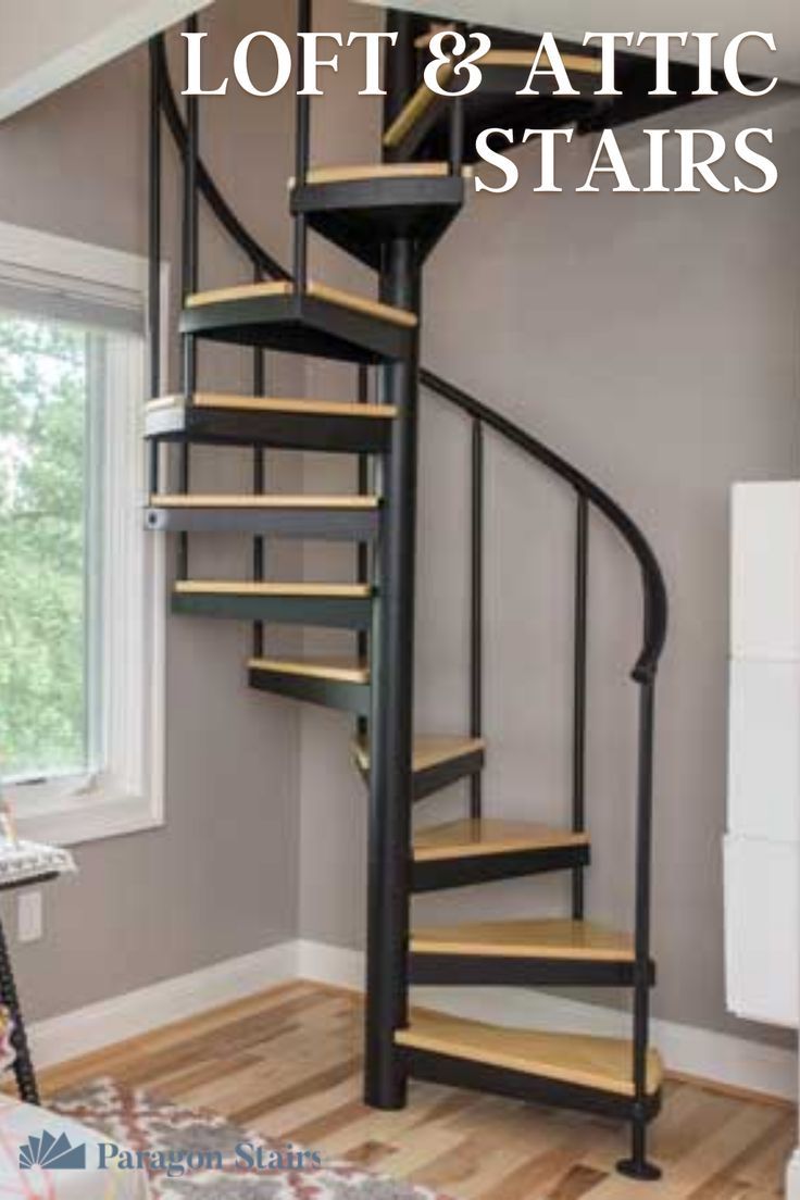 a spiral staircase with the words loft & attic stairs on it in front of a window