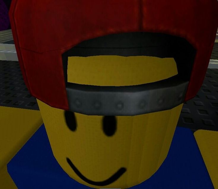 a close up of a lego character wearing a red hat