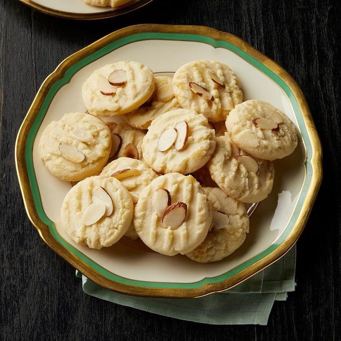 two plates filled with cookies on top of a table