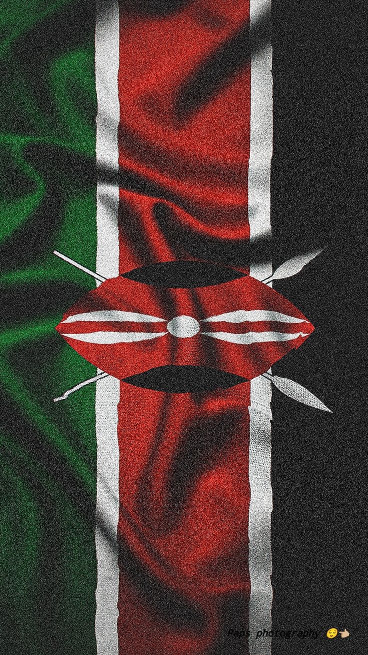 an image of the flag of kenya with scissors stuck in it's diagonal stripes