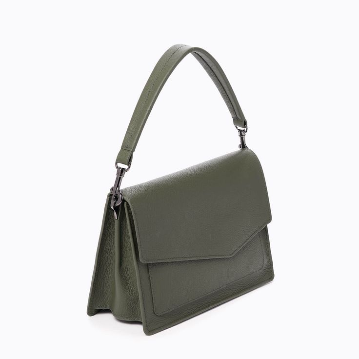 Introducing your go-to bag for fall! The Cobble Hill flap satchel is a new silhouette with a little extra storage for daily life on the go. Crafted with soft pebble leather, the versatile handbag features multiple strap options, plus two removable keychains - one for your card case and one for your airpods. Cool, convenient, and keeps up with your seasonal style...what more could you ask for?! Details Imported pebble leather Gunmetal hardware Magnetic snap flap closure Leather top handle Webbed Modern Flap Bag With Top Carry Handle For On-the-go, Classic Green Satchel For On-the-go, Work Flap Bag With Top Carry Handle, Workwear Flap Bag With Top Carry Handle, Green Satchel Saddle Bag With Adjustable Strap, Green Leather Double Flap Bag, Daily Use Double Flap Shoulder Bag With Detachable Handle, Workwear Bags With Detachable Strap And Flap Shape, Green Office Bag With Detachable Strap