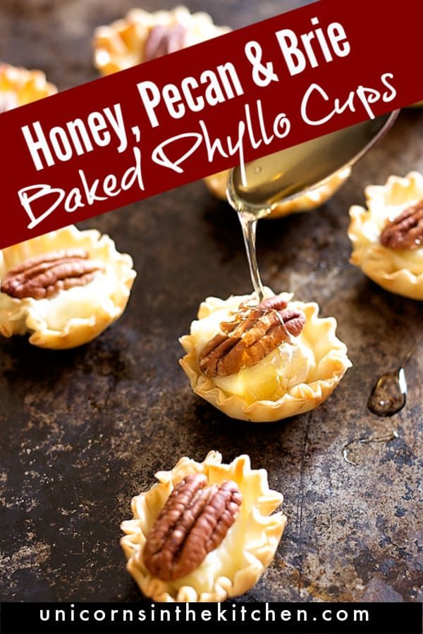 honey, pecan and brie baked glyllo cups are being drizzled with syrup