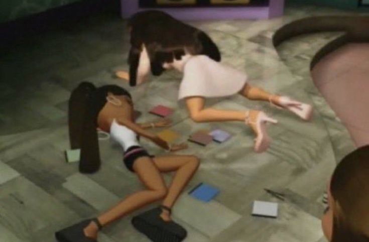 two girls are playing with each other on the floor