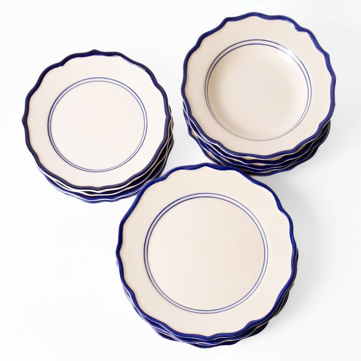 three blue and white plates sitting next to each other