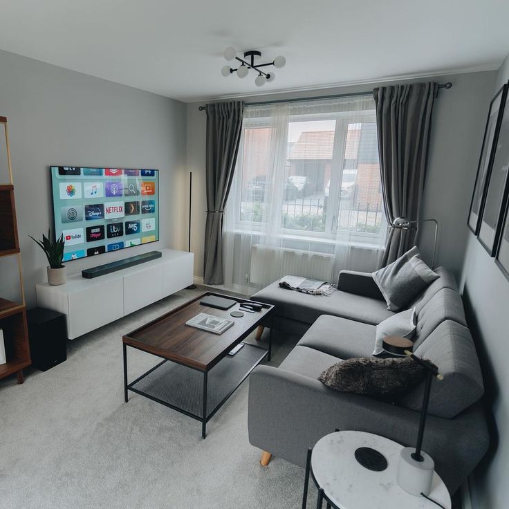 the living room is clean and ready to be used as a home entertainment center or office