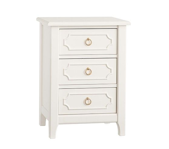 a white nightstand with three drawers and gold pulls on the bottom drawer, against a white background