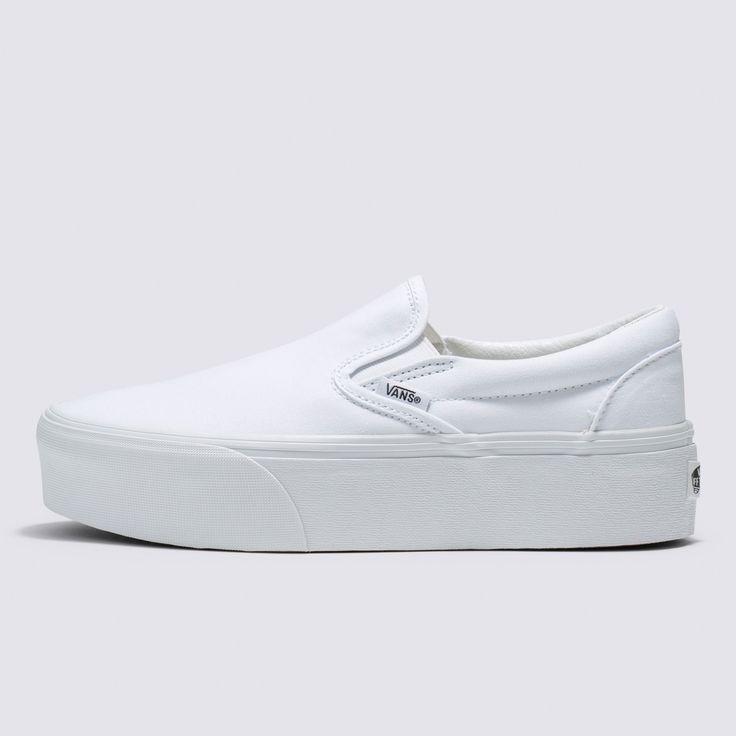 Our Trend-Setting Slip-On Reaches New HeightsThe Classic Slip-On Stackform Canvas refreshes our original slip-on silhouette with an even chunkier take on the platform aesthetic. Constructed with an exaggerated sidewall for double the height, this platform shoe amplifies a classic favorite while bringing a new “Off The Wall” style to your look. Iconic Slip-On shoe 34 mm platform height Sturdy canvas uppers Elastic side accents Supportive padded collars Signature rubber waffle outsoles | Vans Clas White Thick Bottom Canvas Shoes For Streetwear, White Thick Bottom Canvas Shoes For Spring, White Vulcanized Sole Slip-ons For Streetwear, Thick Bottom Slip-on Platform Sneakers For Streetwear, Vans White Platform Sneakers With Vulcanized Sole, White Vans Platform Sneakers With Vulcanized Sole, White Slip-on Platform Sneakers With Thick Bottom, Vans White Slip-on Sneakers With Rubber Sole, White Vans Casual Platform Sneakers