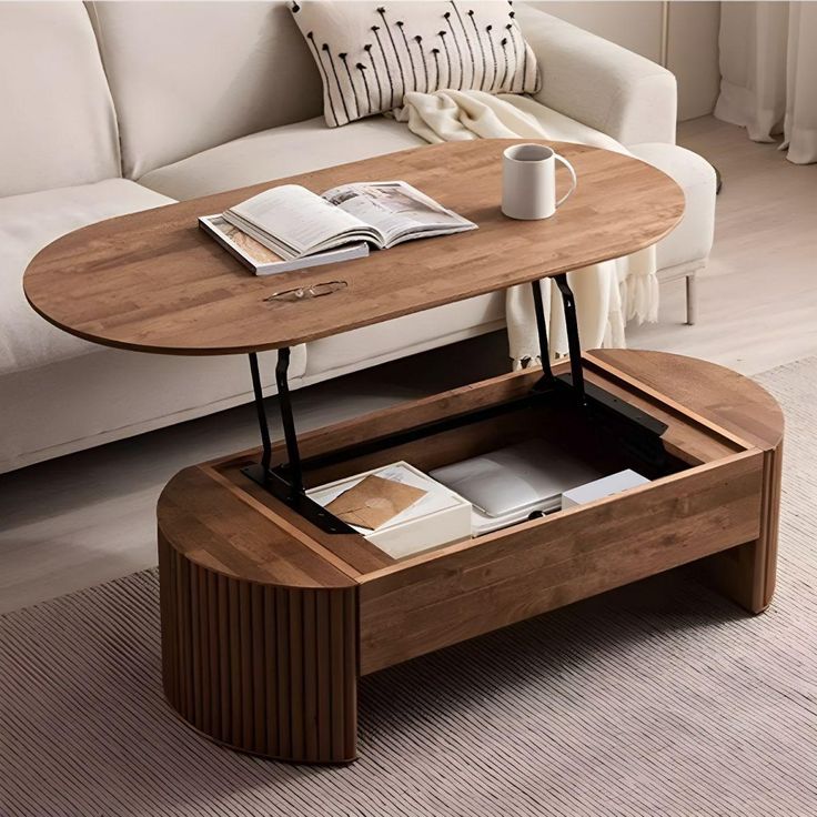 a coffee table with an open drawer underneath it and a book on the end shelf