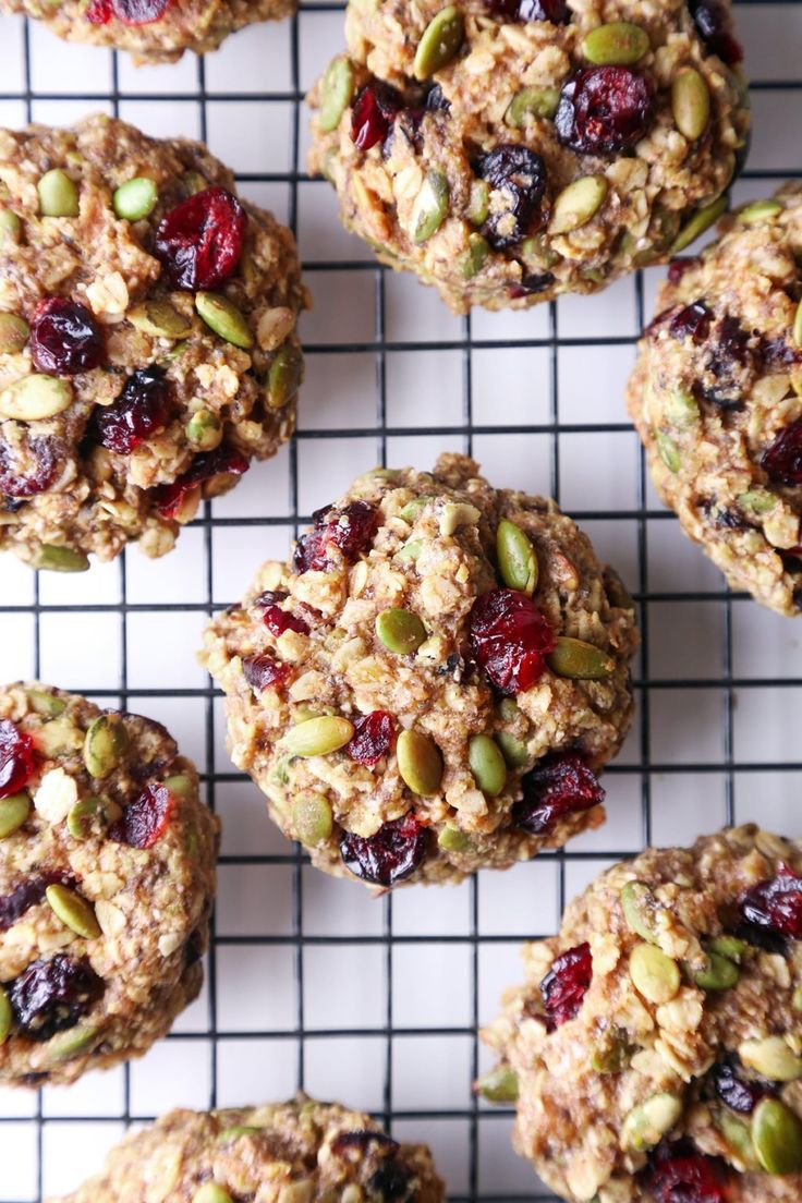 muffins with cranberries and nuts on a cooling rack, ready to be eaten