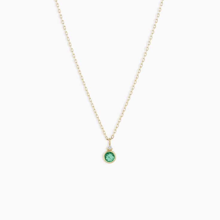 A modern heirloom. Introducing our take on a traditional style. Whether you wear yours or a loved one’s, a birthstone necklace is an easy way to add color and meaning to your look. This birthstone necklace features a 14k gold chain and diamond detail and makes for a perfect, personal gift. Emerald is May's birthstone. Product Details Diamond: 0.01 total carat weight, 1.3 mm GH SI1-SI3 Emerald: 0.15 total carat weight, 3 mm genuine emerald 14k solid gold 16" chain + 2" extender. Adjustable in 1" Everyday Jewelry With Bezel Setting For May Birthstone, 14k Gold Jewelry With Gemstone Accents For May Birthstone, Elegant Green Stackable Jewelry, Elegant Faceted Jewelry In Recycled Gold, Elegant Recycled Gold Faceted Jewelry, 14k Gold Filled Jewelry With Gemstone Accents, Minimalist Jewelry With Bezel Setting And Round Stone, Minimalist Jewelry With Bezel Setting, Green 14k Gold Jewelry With Bezel Setting