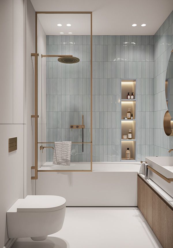 an instagram page with a white bathroom and gold accents on the shower, tub, toilet and sink