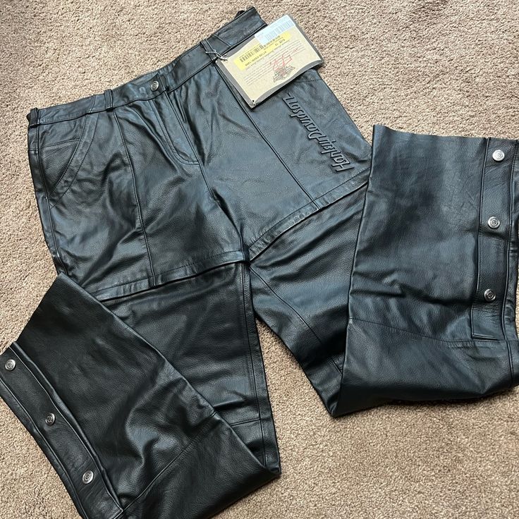 Black Leather Harley Riding Pants Size 12, Zip Off Into Shorts, Nwt. Inseam Is 33.5” And Waist Is 16.75” Or 33.5” Biker Bottoms Straight Leg For Motorcycling, Biker Straight Leg Bottoms For Motorcycling, Biker Style Straight Leg Bottoms For Motorcycling, Biker Pants With Pockets For Motorcycling, Fitted Straight Leg Motorcycling Pants, Fitted Straight Leg Motorcycle Pants, Casual Pants With Pockets For Biker Events, Casual Pants For Biker Events In Fall, Black Motorcycle Bottoms With Belt Loops