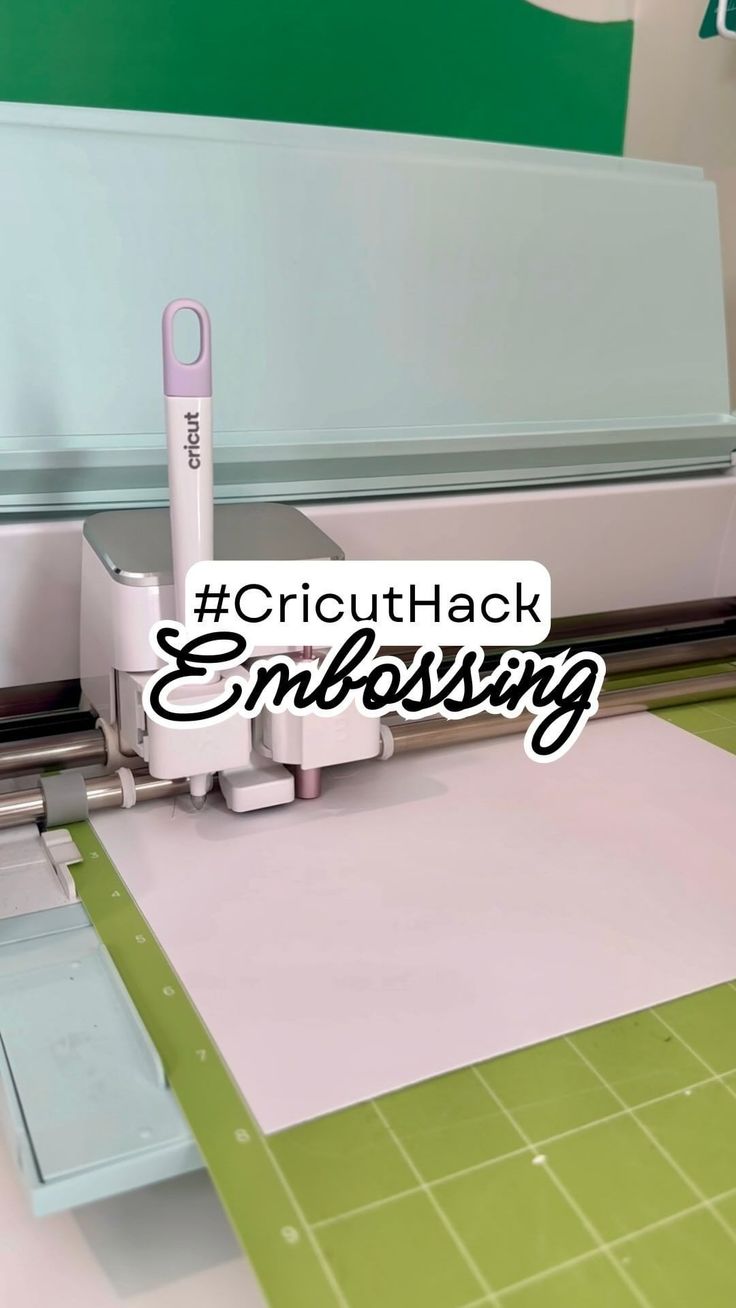 the cricuthack embossing machine is cutting paper with a pink pen