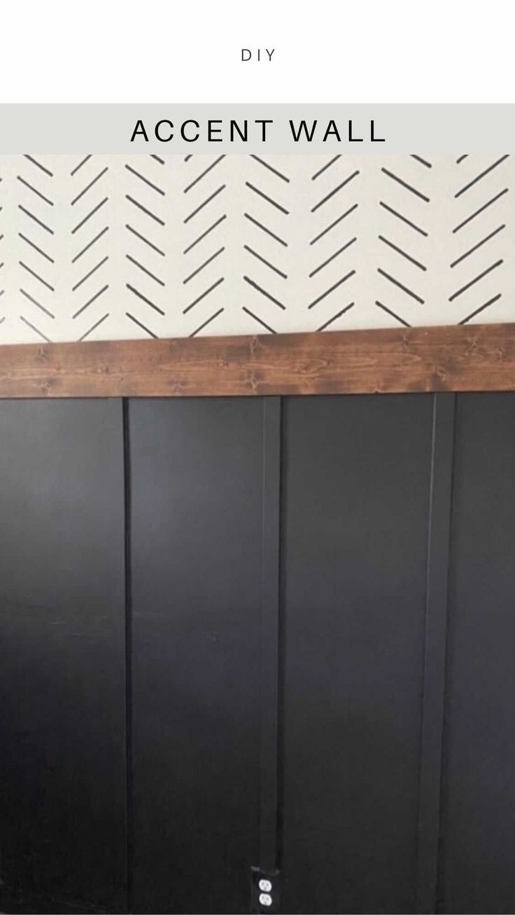 the diy accent wall is painted black and white with an arrow pattern on it