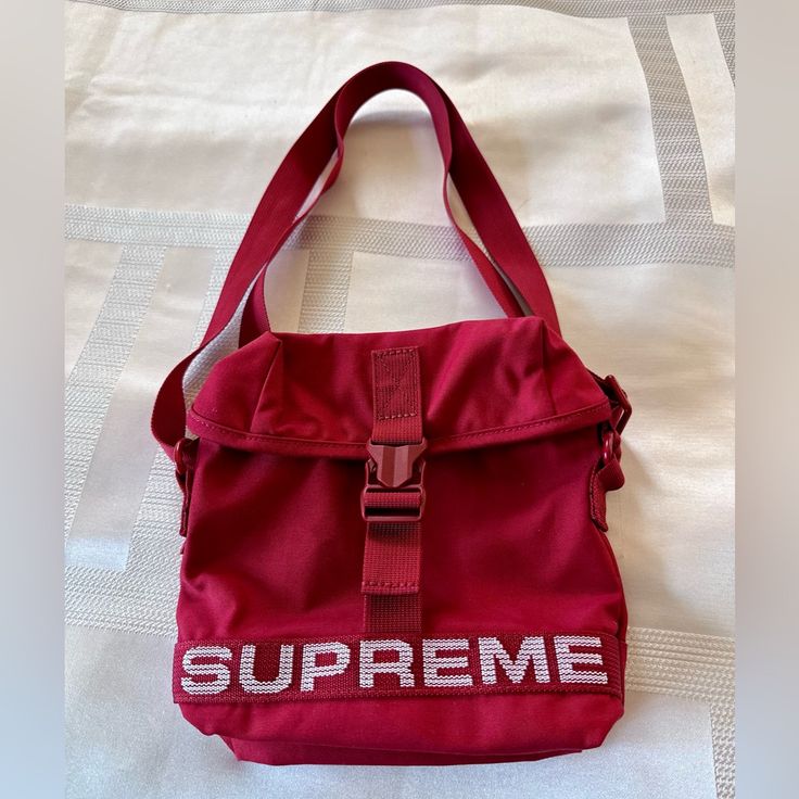 Nwt Supreme Red Side Bag Designer Large Capacity Red Shoulder Bag, Designer Red Shoulder Bag With Large Capacity, Luxury Large Capacity Red Shoulder Bag, Designer Red Pouch Satchel, Designer Rectangular Red Bag, Designer Red Shoulder Bag For Travel, Luxury Red Bags For Everyday Use, Designer Red Rectangular Bucket Bag, Red Functional Shoulder Bag With Removable Pouch