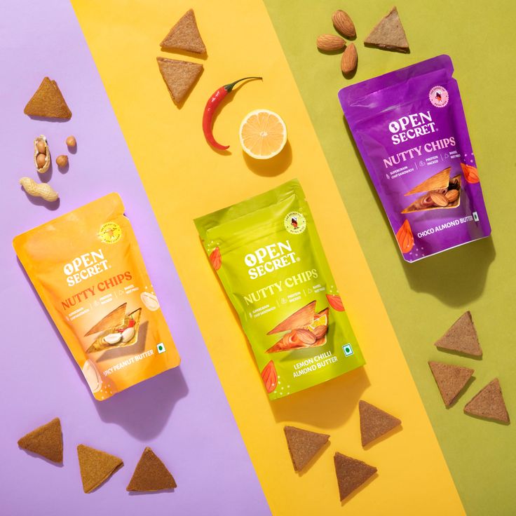 an assortment of healthy snacks laid out next to each other on a colorful table top