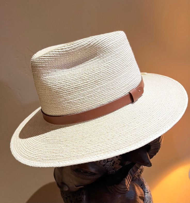 Panama Fine Palm Tear Drop Fedora with a 3 Inch Brim. Did you know that Panama Hats are not made in Panama?  They are hand woven in Guatemala and Ecuador by native craftsmen and the art of fine weaving is passed down the family. Panama Hat - Fine Palm Woven Fedora with a 3 Inch Brim -  10-12 braided fine woven palm strands per inch   -  3" Brim, 5-1/2" crown with Tear drop crease -  5/8" wide leather band in black or brown - Tear Drop shape 2 Available  Sizes:  7  with Black leather band 7-1/8 Handwoven Natural Hat Band With Flat Brim, Western Style Natural Woven Panama Hat, Natural Woven Western Hat Bands, Artisan Woven Panama Hat With Short Brim, Western Natural Color Woven Hat Bands, Artisan Woven Panama Hat With Flat Brim, Artisan Woven Flat Brim Panama Hat, Western Handwoven Natural Hat Bands, Handwoven Natural Western Hat Bands