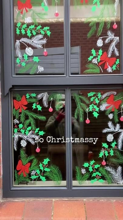 a window with christmas decorations on it