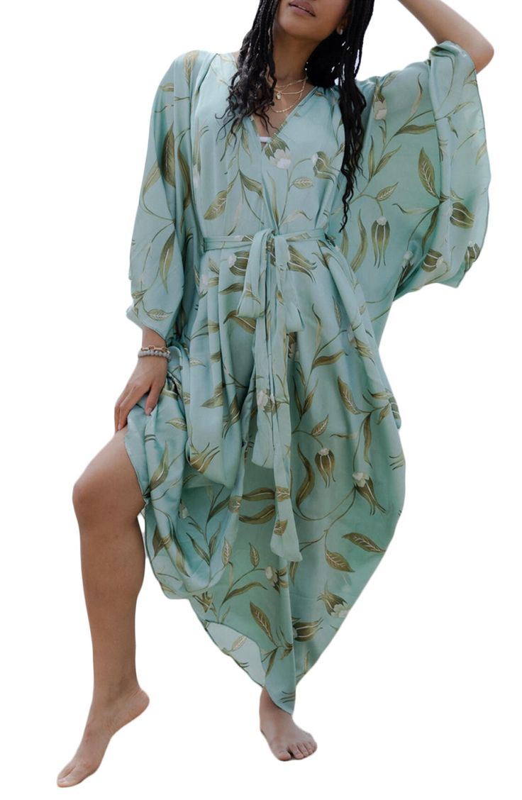 Perfect for poolside hangs or kicking it in the sand, this tie-front kaftan is the perfect accessory to add to your sun-loving wardrobe. V-neck Short sleeves 100% polyester satin Hand wash, line dry Imported Model stats: 5'10", 32" bust, 25" waist, 36" hip. Model is wearing size One Size. Bohemian Tie Waist Cover-up For Beach Season, Breezy Wrap Cover-up For Vacation, Flowy V-neck Kaftan For Day Out, Summer Beach Cover-up With Tie Waist, Spring V-neck Swimwear With Tie Waist, Beach Season Cover-up With Tie Waist, Bohemian V-neck Tie Waist Cover-up, V-neck Tie Waist Beach Cover-up, V-neck Kaftan For Beach Vacation