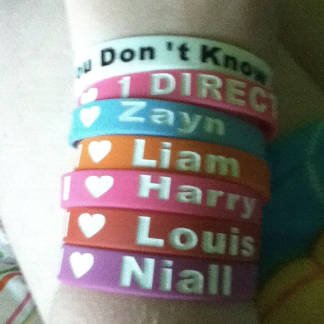 several bracelets that say i don't know direct, direct, zayn, llam, harry, louis and nail