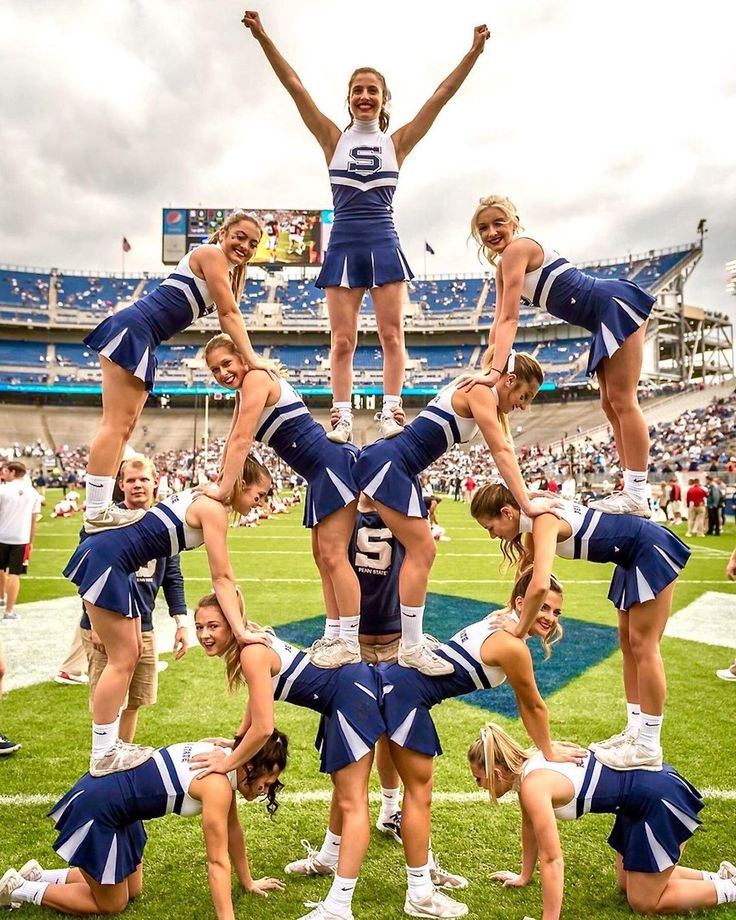 the cheerleaders are doing tricks on the field