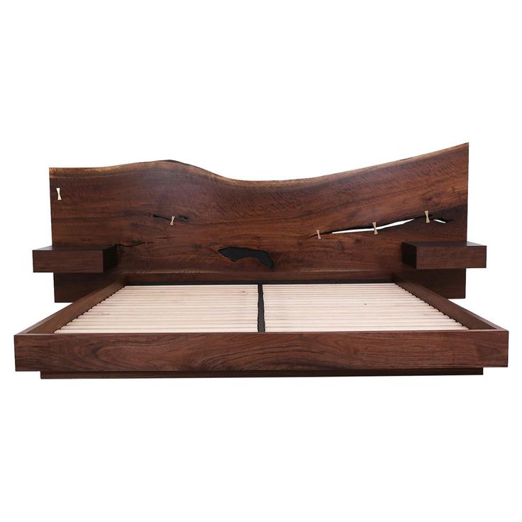 a wooden bed frame with two headboards and no sheets on the bottom, in front of a white background