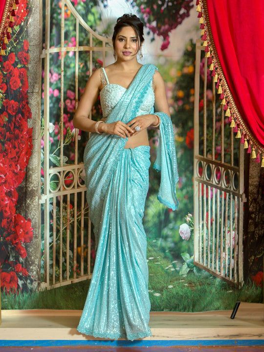 Ruffled saree has been a perfect garment that has always reflected a woman’s beauty and elegance! This figure flattering shimmer saree can be a perfect outfit for any event! Color - Aqua Blue Fabric & Work Style - - Sequin - Plain Light blue Blouse work Size 34-38 Blouse from the Picture Sold Separately Details - - Assured quality. - Wash care instruction: Dry clean only. - Slight variation in color is possible due to digital photography. Blue Work Blouse, Shimmer Saree, Ruffled Saree, Indian Bridal Couture, Sky Blue Saree, Light Blue Blouse, Fabric Work, Blue Lehenga, Blue Saree